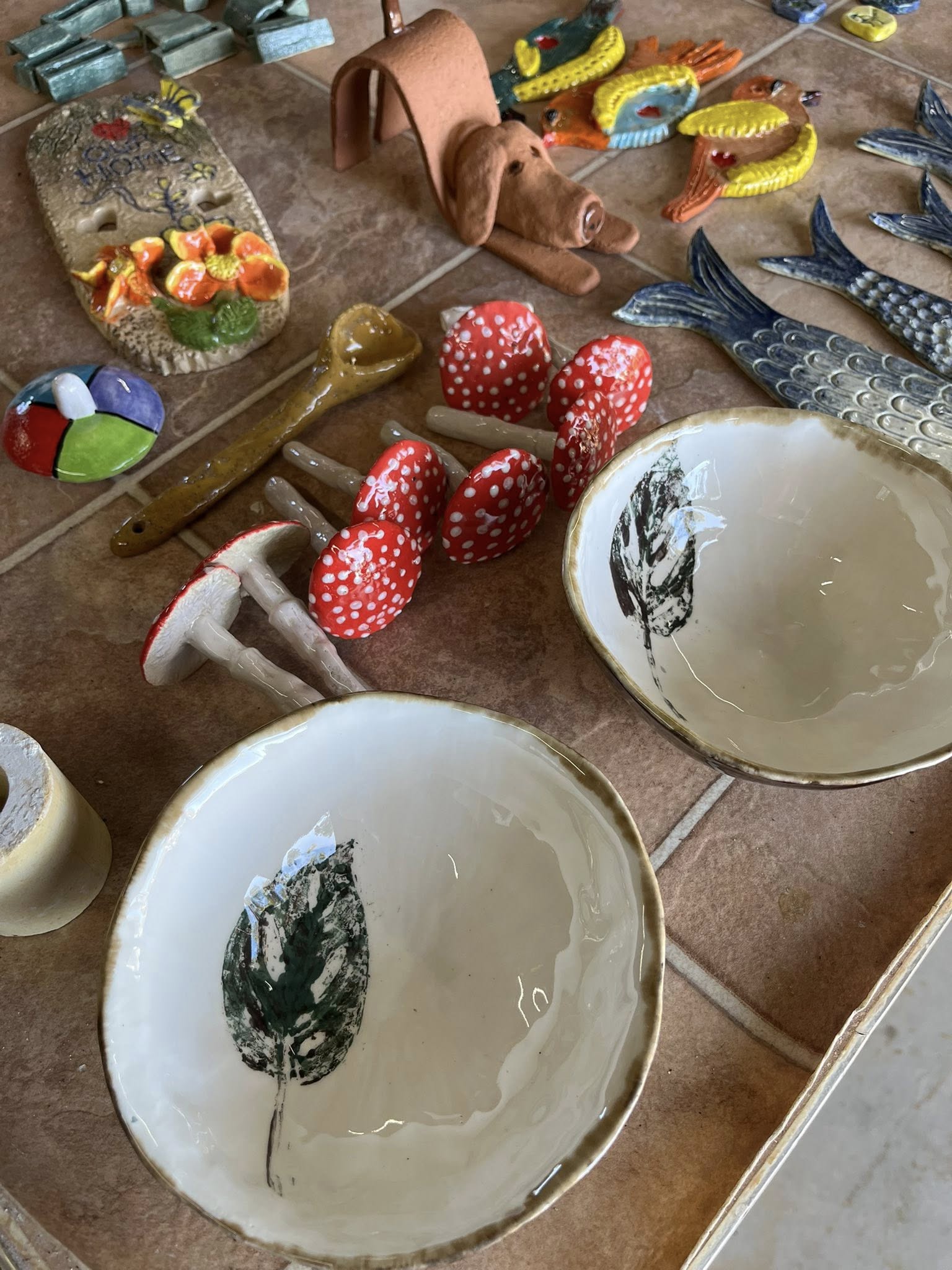 Display of handmade bowls and pottery pieces